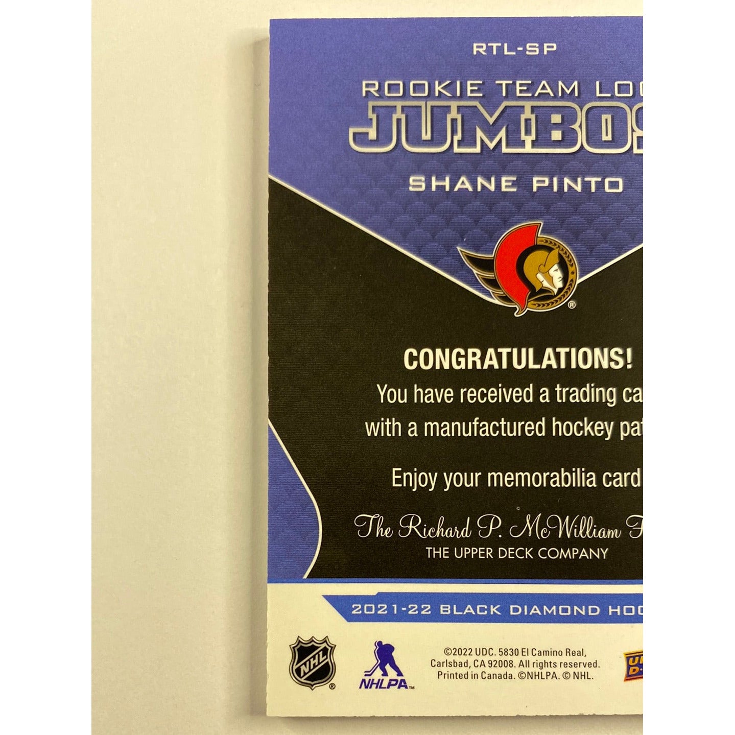 2021-22 Black Diamond Shane Pinto Rookie Team Logo Jumbos